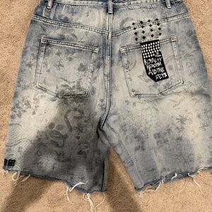 Ksubi Faded Blue Jean Shorts with Graphic Details